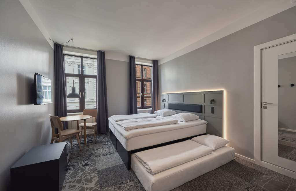 Værelse med opredning til tre personer på Hotel København